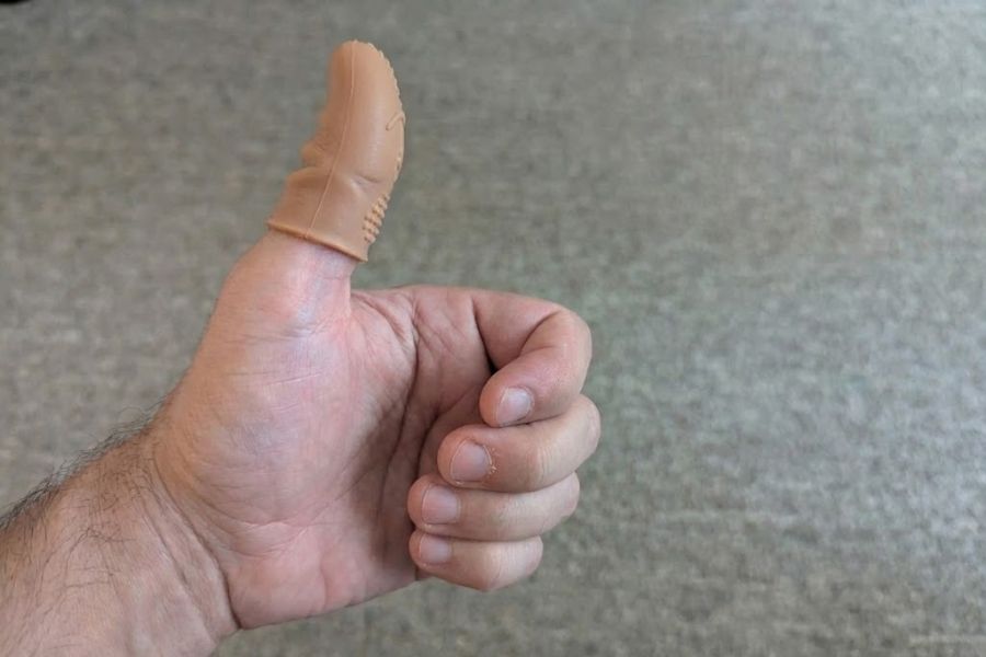 thumb with a finger guard to help prevent nail biting