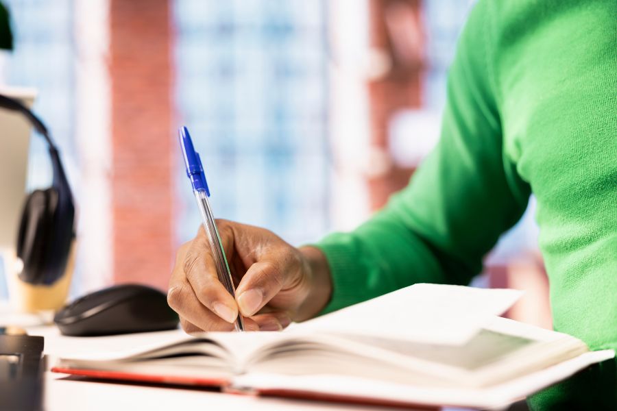 Girl studying and writing notes